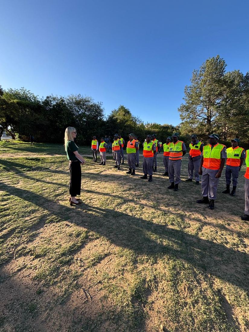 Lauren-Kate Fletcher addressing a lineup of security guards